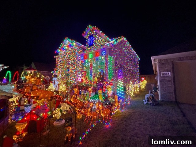 An expansive shot of the Burkman Holiday Home's exterior, covered from roof to lawn with thousands of twinkling Christmas lights and decorations.