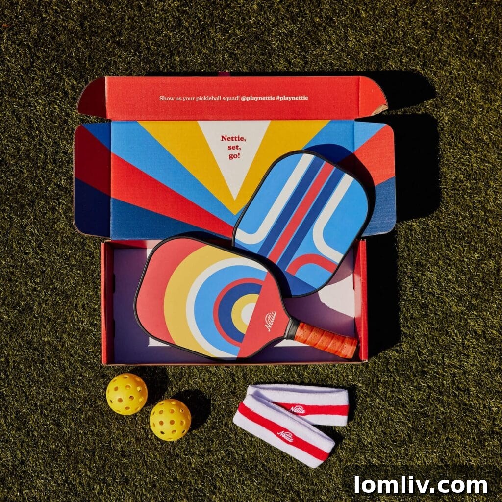 The Ultimate Holiday Gift Guide 4 A vibrant and stylish Nettie Pickleball Set featuring two rackets and balls, ready for the court.