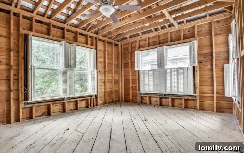 Interior view of a unit stripped to studs, ready for renovation