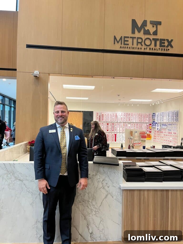 Taylor Walcik, MetroTex Board President, smiling at the grand opening event