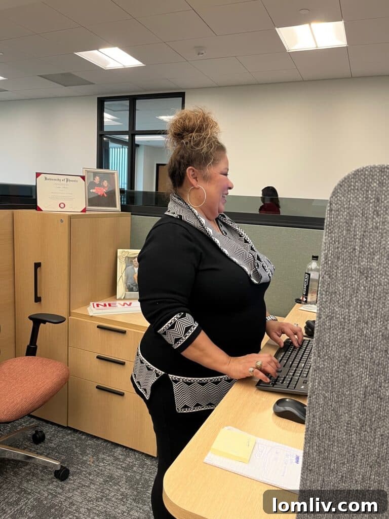 MetroTex accountant Evelyn Villalon diligently working during the grand opening celebration