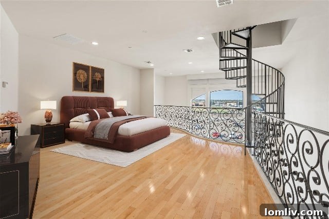 Owner's suite with spiral staircase to rooftop deck, Fort Worth condo