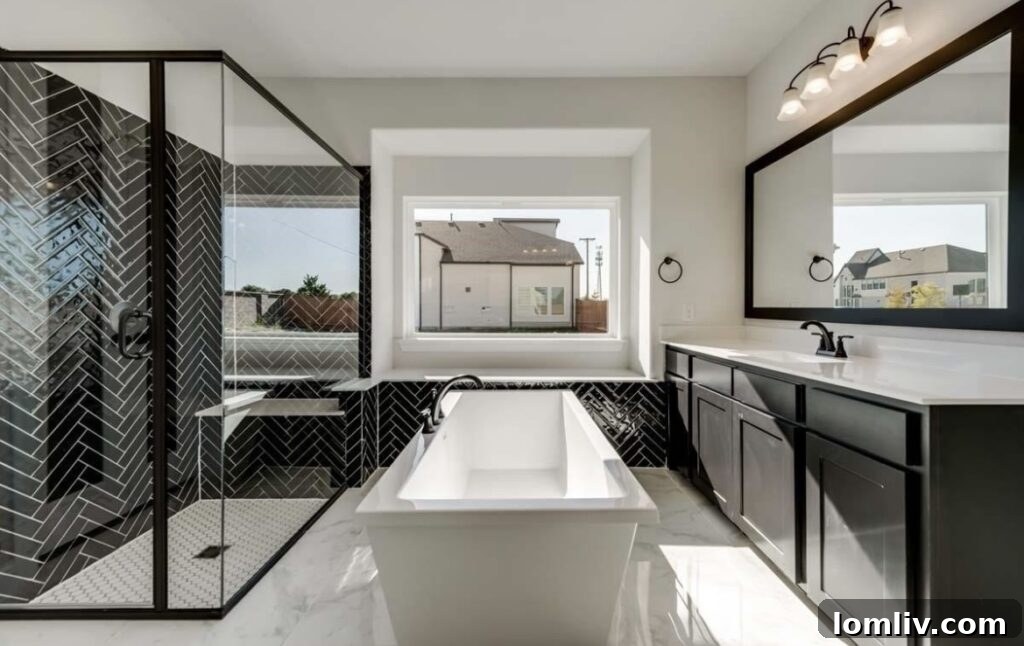 Luxurious master bath with freestanding tub and elegant tilework