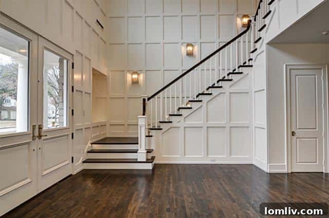 Grand Foyer with Paneled Walls and Hardwood Floors 4337 Westway