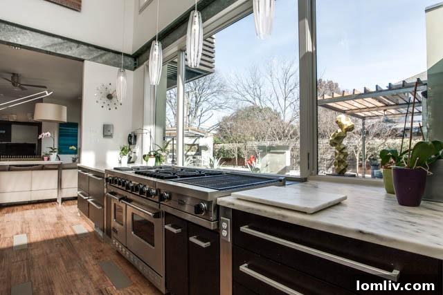 Another view of the sophisticated kitchen, highlighting architectural details and lighting