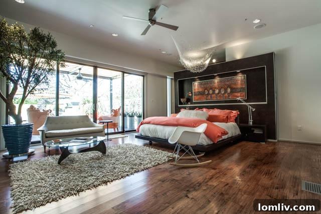 Another view of a tastefully decorated bedroom in the Dallas luxury home
