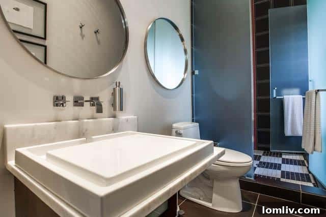 Stylish bathroom with contemporary fixtures and finishes in the luxury home