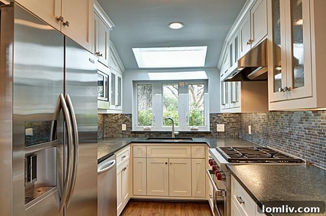 Sleek galley kitchen featuring a Wolf range and stainless steel appliances