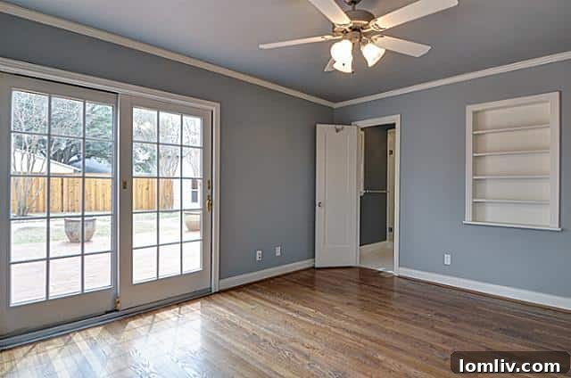 Serene master suite with sliding full-light doors to the deck