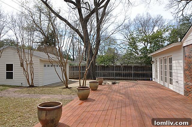 Spacious outdoor deck and detached two-car garage at 5446 Glenwick