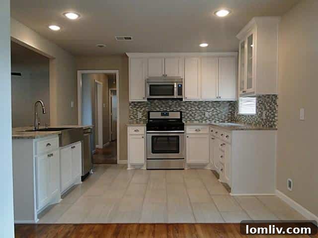 Tuesday Two Hundred Unveils Lochwood's Nearly Perfect Midcentury Modern Remodel 4 1120-Flamingo-Kitchen