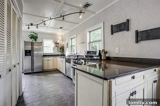 Spacious Kitchen with Coffered Ceiling and Granite Counters