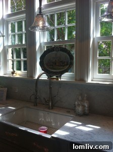 Renovated kitchen with white marble and natural light