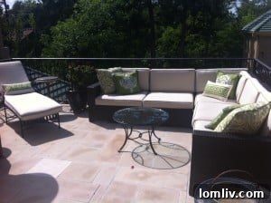 Second story outdoor patio overlooking backyard