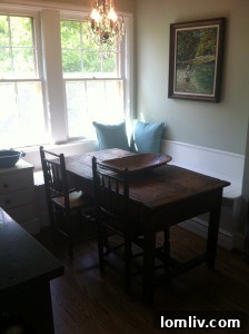 Carriage house dining area with antique dough table