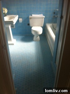Original bright blue bathroom with crystal and white accents