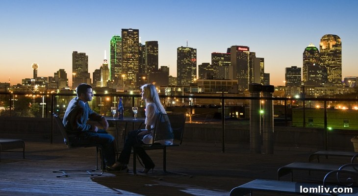 Mitchell Lofts Rooftop Deck at night with city views