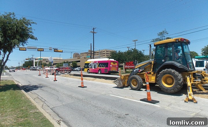 Workers complete Phase One of the Oak Cliff streetcar at Colorado Boulevard on Thursday, May 15.