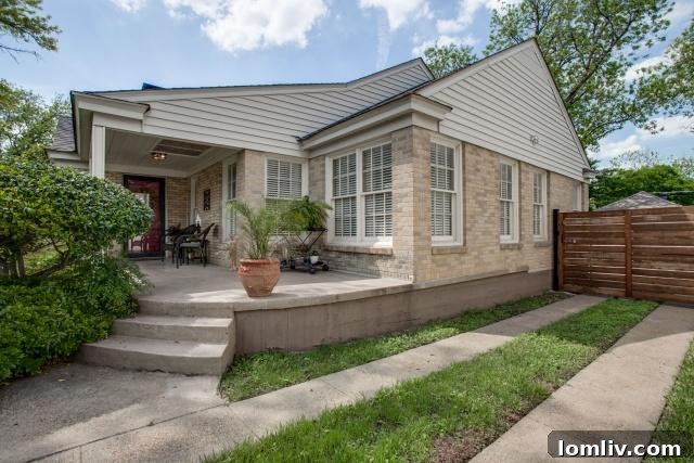 Side view of the 1940s cottage at 2531 W 10th Street, highlighting its traditional architecture and well-maintained facade