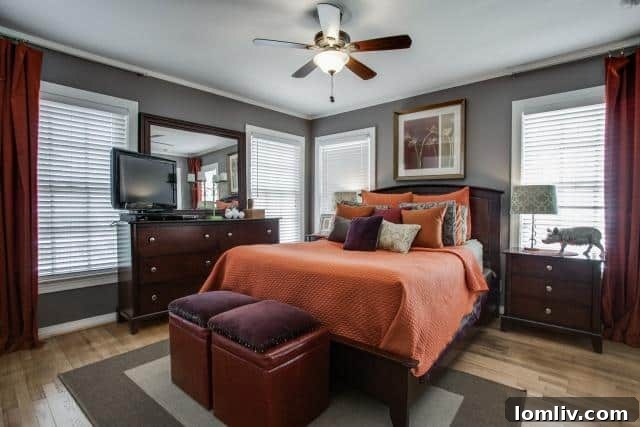 Master bedroom at 2531 W 10th Street with dark gray walls, jewel-toned decor, and ample natural light
