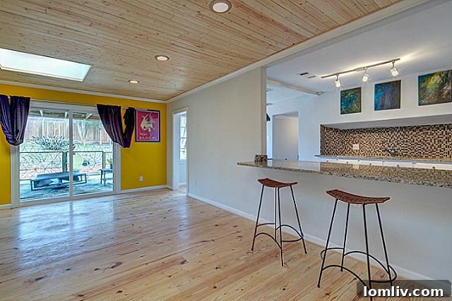 Spacious family room, perfect for relaxation and entertainment at 9003 Groveland