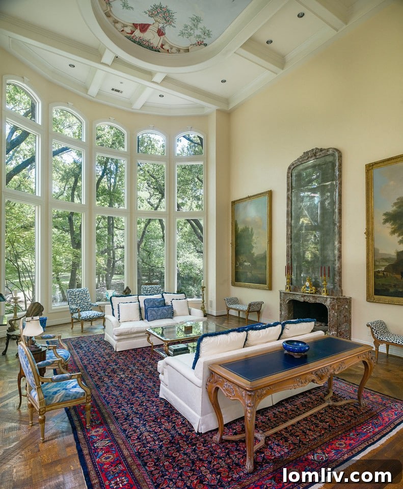 Spacious formal living room with soaring ceilings and lush garden views at 9250 Meadowbrook