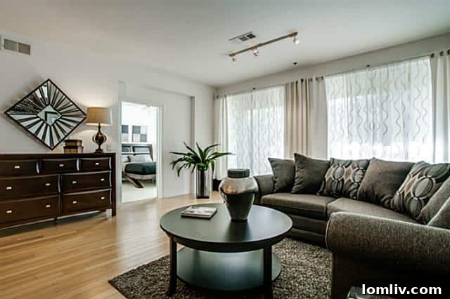 Bright and spacious open-concept living area of the Oak Lawn condo