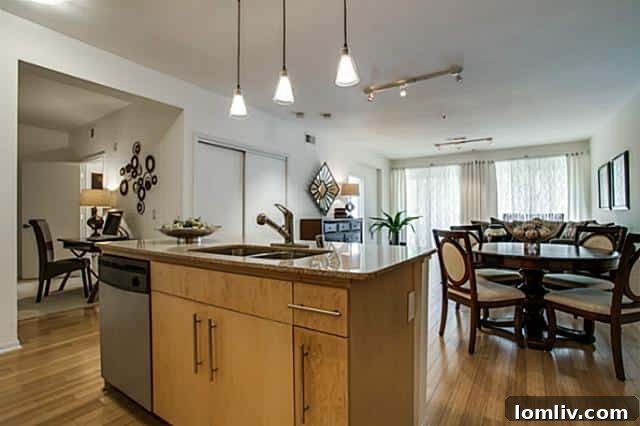 Spacious kitchen island with granite countertops and stainless steel appliances
