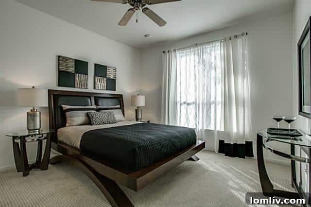 Spacious bedroom with large windows and comfortable carpeting in the Dallas condo