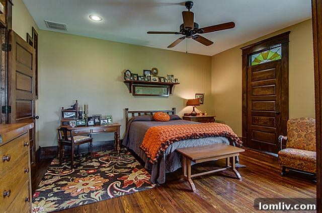 Luxurious master bedroom at 2113 Mangum, featuring elegant decor, a comfortable bed, and ample natural light, creating a serene and comfortable retreat.