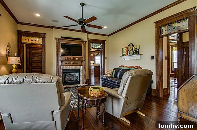 Bright and spacious main living room area at 2113 Mangum, showcasing comfortable furnishings, ample natural light, and tasteful decor, ideal for relaxation and family time.