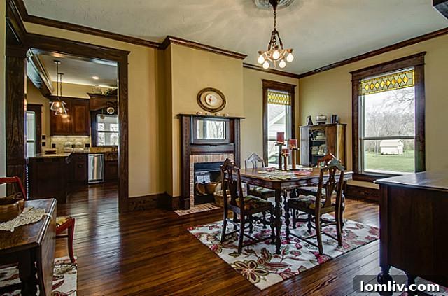 Elegant dining room at 2113 Mangum, meticulously set for entertaining with a classic dining table and chairs, reflecting the home's sophisticated historic character and readiness for grand meals.