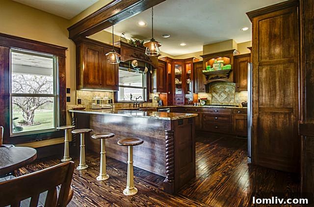 View of a beautifully appointed wet bar area or perhaps a secondary prep area within 2113 Mangum, featuring custom cabinetry, elegant finishes, and ample space for beverage service.
