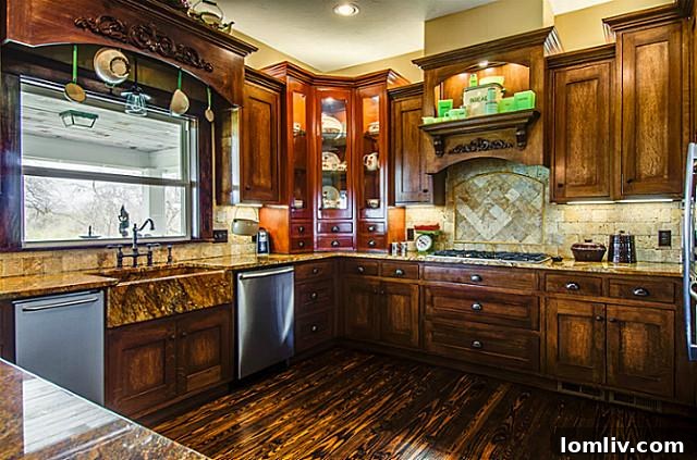 Spacious farmhouse kitchen at 2113 Mangum, featuring an inviting apron sink, state-of-the-art modern appliances, generous counter space, and custom cabinetry, perfectly blending historic style with contemporary convenience.