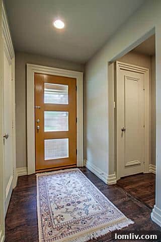 Welcoming foyer of the renovated Midcentury Modern home at 6202 Monticello, Dallas