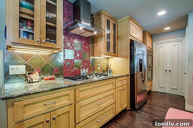 Contemporary kitchen view highlighting custom light fixtures in the Lakewood Heights home