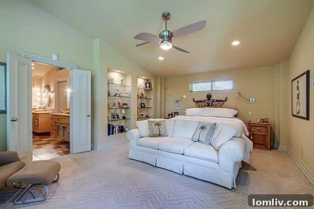Master bedroom featuring unique zebra print carpet and abundant natural light at 6202 Monticello