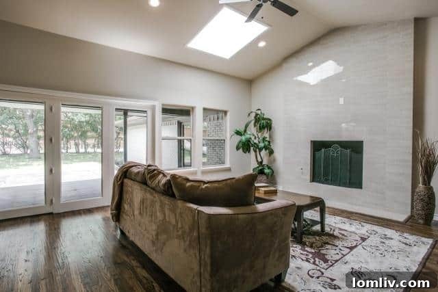 Spacious living room at 3747 Duchess Trail featuring a fireplace and hardwood floors