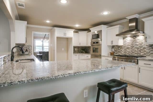 Modern kitchen with stainless steel appliances and granite countertops
