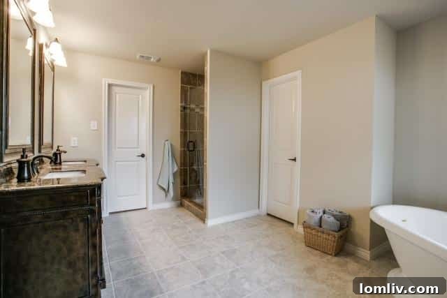 Spacious walk-in shower with frameless glass in the master bathroom