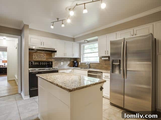 Beautifully Renovated Kitchen with Island and Granite Countertops