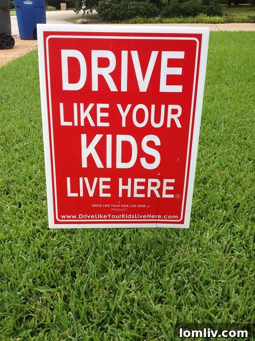 Drive like your kids live here - a sign promoting safer driving
