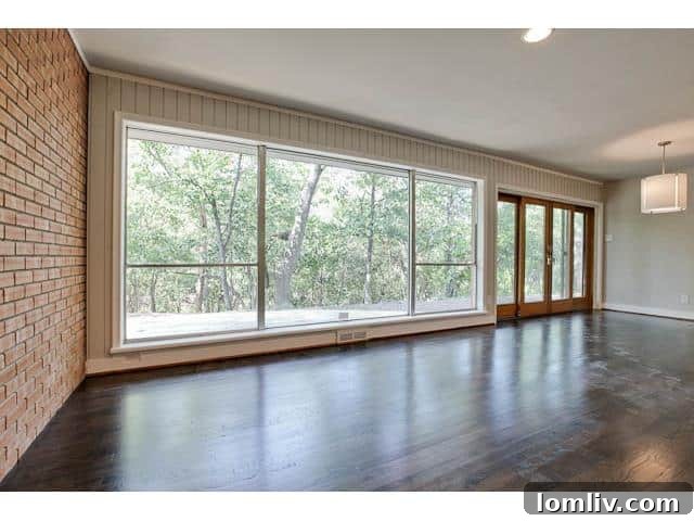 Open Concept Living and Dining Space with Backyard Views