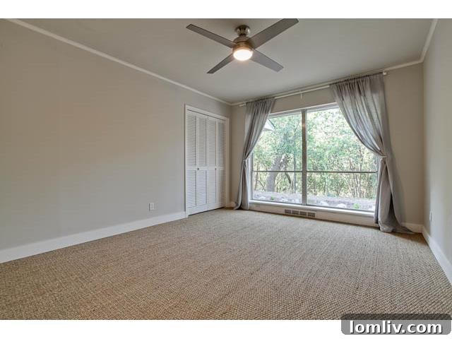 Luxurious Master Bedroom with Hardwood Floors and Natural Light