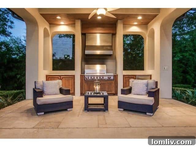 Elegant cabana with an outdoor kitchen next to the pool