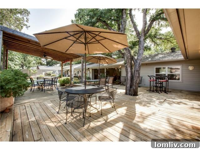 Expansive Deck and Patio Area Shaded by Mature Tree