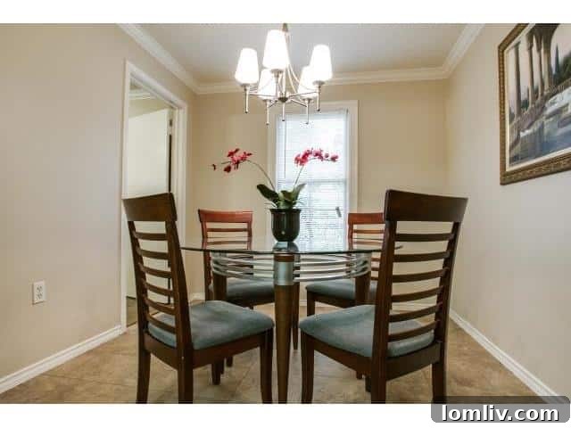 Dining area with a view into the kitchen, emphasizing layout considerations in home renovation.