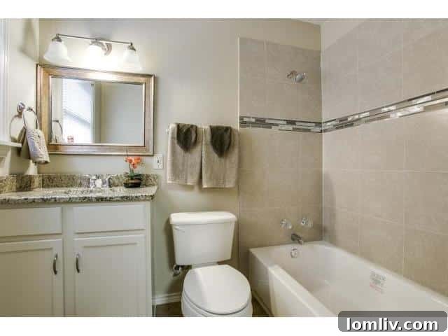 Newly installed bathtub with a sticker, indicating recent but potentially minimal bathroom renovation.