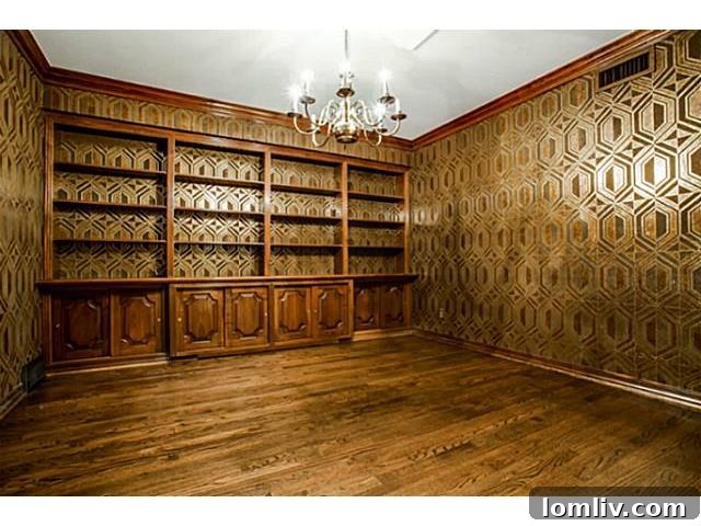 6832 Westlake Study - Post Renovation: A sophisticated space with preserved gilded wallpaper