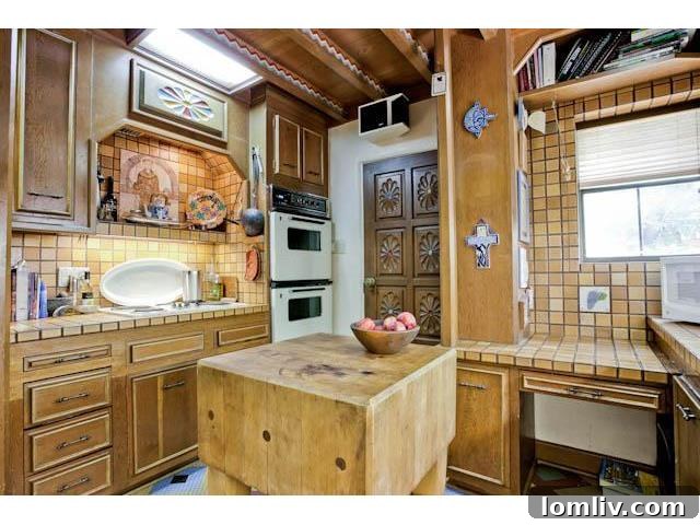 Another angle of the kitchen, highlighting its unique vintage appeal and functional layout for light cooking.